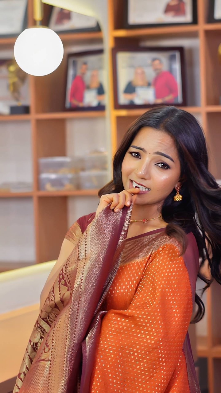 Occasion makeup and soft waves with an orange and gold saree