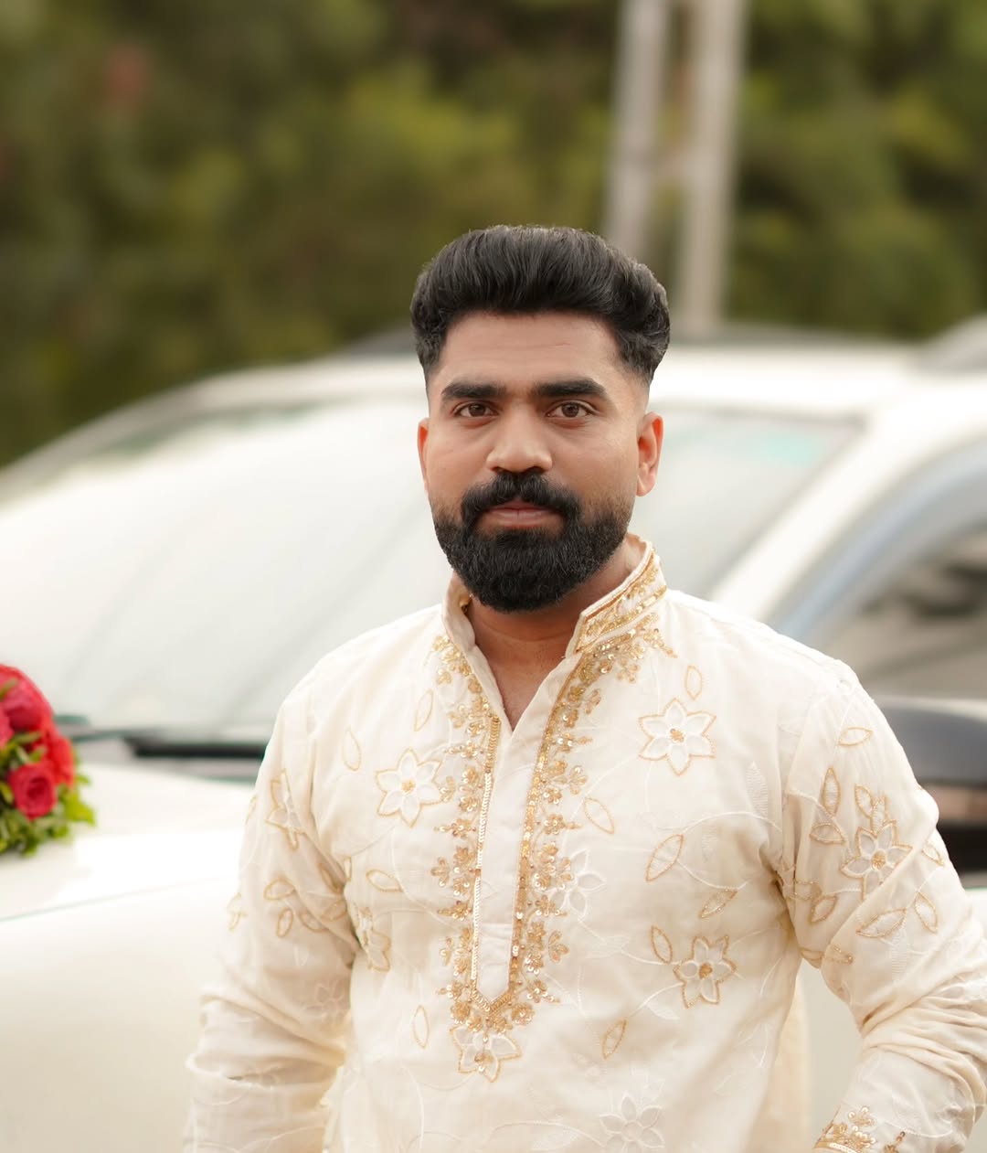 A groom with a shaped beard and styled hair, finished at D Cube